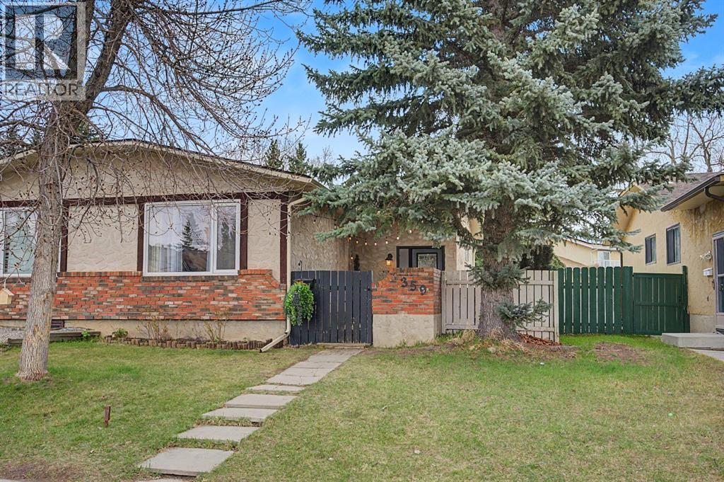 359 Woodvale Crescent SW, Calgary, Alberta  T2W 3L3 - Photo 1 - A2307643