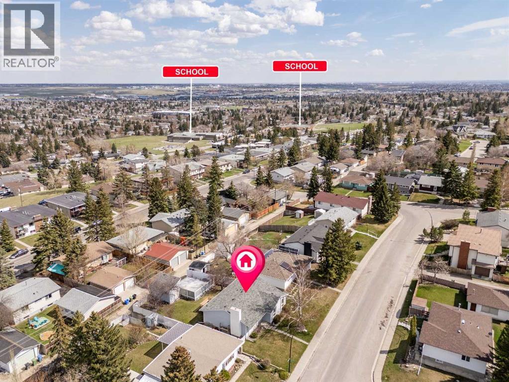 7720 Hunterquay Road Nw, Calgary, Alberta  T2K 4T8 - Photo 4 - A2308100