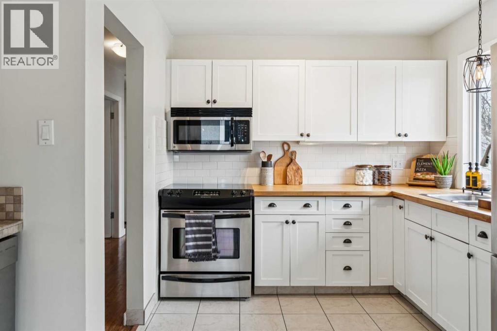 19 Hyslop Drive SW, Calgary, Alberta  T2V 3A2 - Photo 9 - A2308094