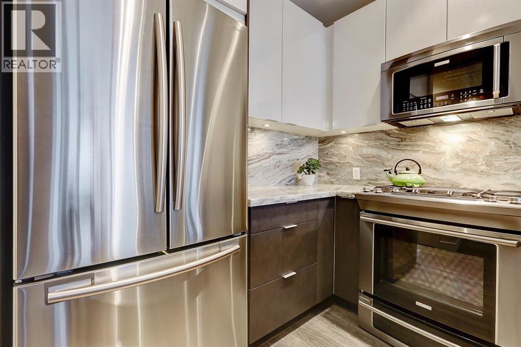 119 Confluence Mews Se, Calgary, Alberta  T2G 1J1 - Photo 11 - A2304002