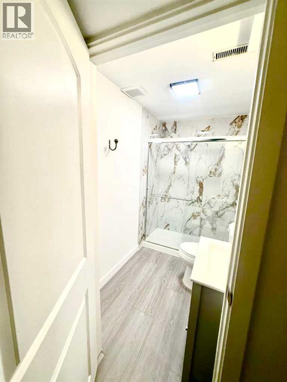 7212 Sierra Morena Boulevard SW, Calgary, Alberta  T3H 3G5 - Photo 23 - A2308935