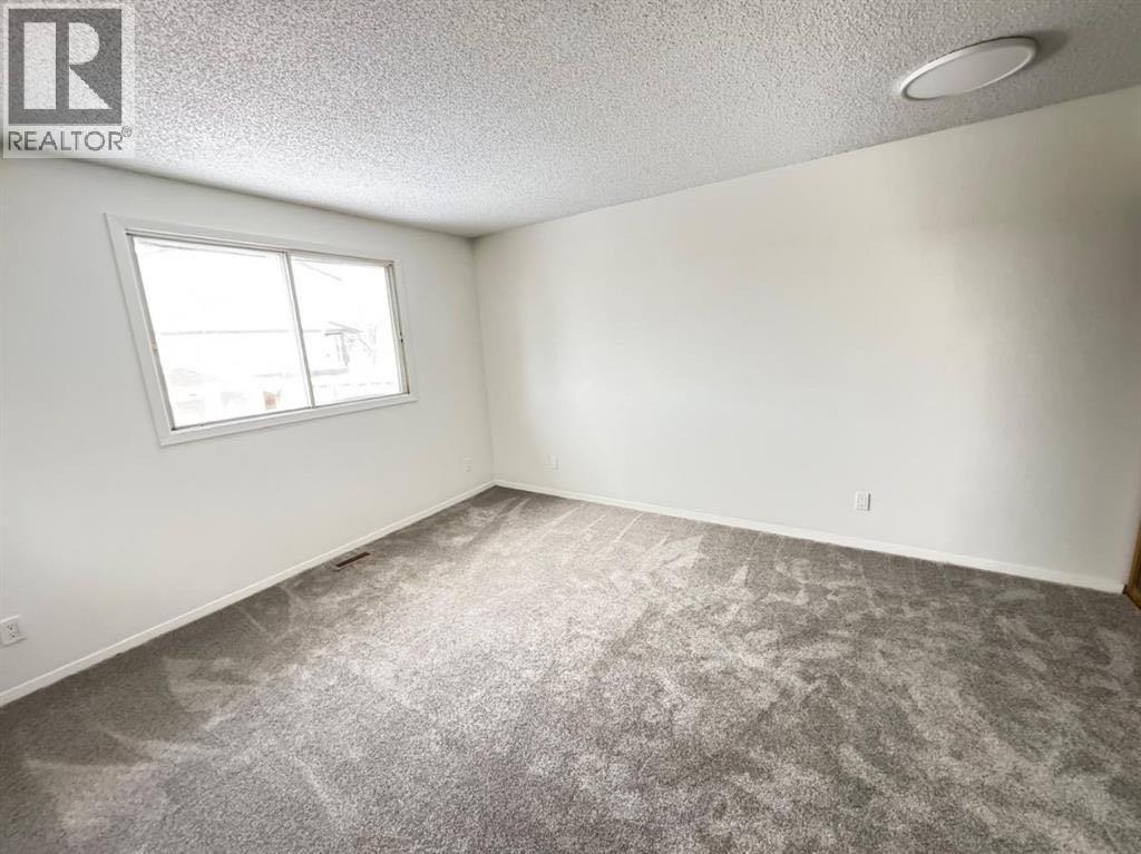 6879 Rundlehorn Drive NE, Calgary, Alberta  T1Y 4P2 - Photo 7 - A2293760