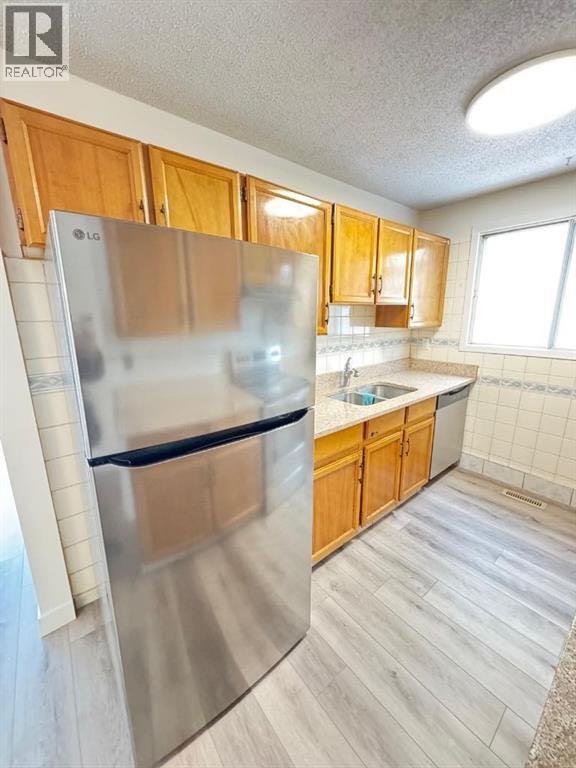 6879 Rundlehorn Drive NE, Calgary, Alberta  T1Y 4P2 - Photo 5 - A2293760