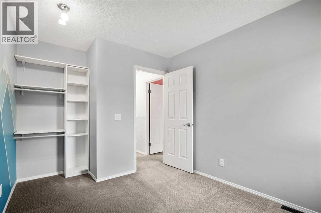 103 Coachway Lane Sw, Calgary, Alberta  T3H 2V9 - Photo 32 - A2290563