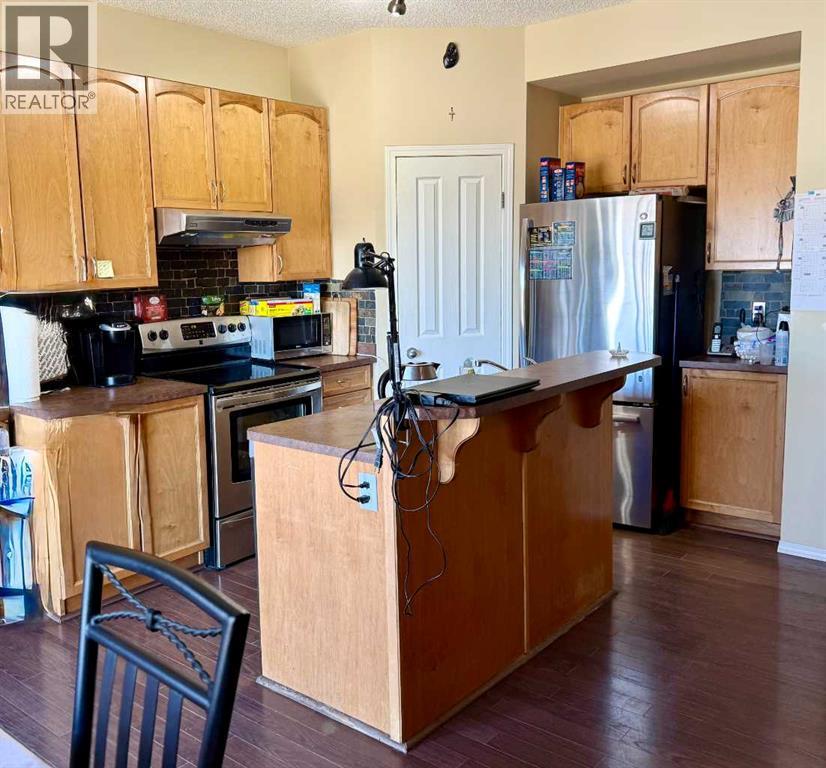 13 Tuscany Ridge Mews NW, Calgary, Alberta  T3L 3B7 - Photo 5 - A2303363