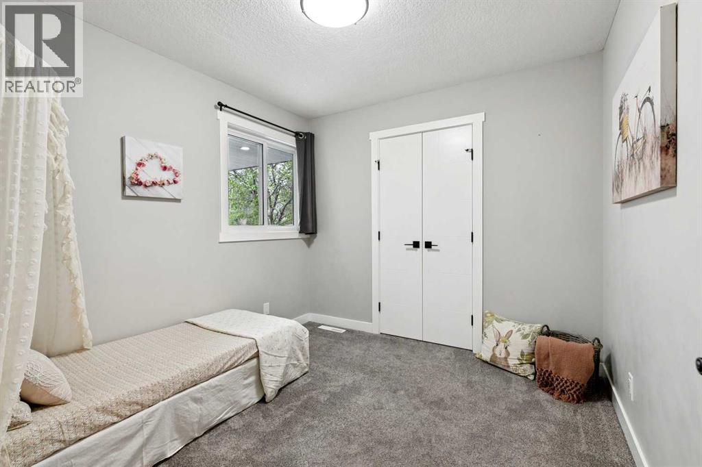 7116 Hunterwood Road NW, Calgary, Alberta  T2K 4J6 - Photo 21 - A2311232