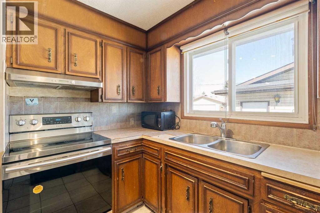 7003 Temple Drive Ne, Calgary, Alberta  T1Y 4Z4 - Photo 8 - A2307481