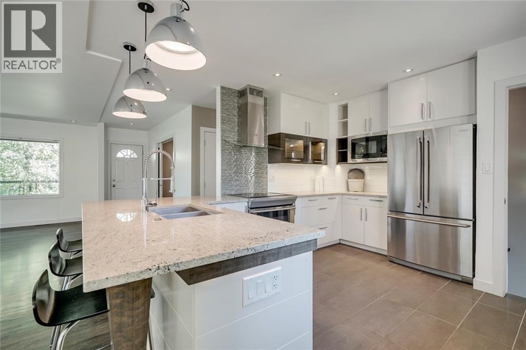 2203 25 Avenue NW, Calgary, Alberta  T2M 2C2 - Photo 7 - A2311804