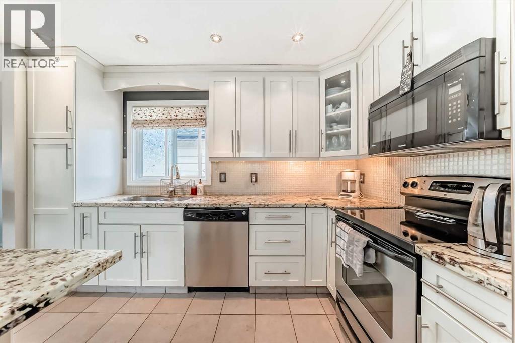 20 Woodbrook Close SW, Calgary, Alberta  T2W 4E9 - Photo 6 - A2301228