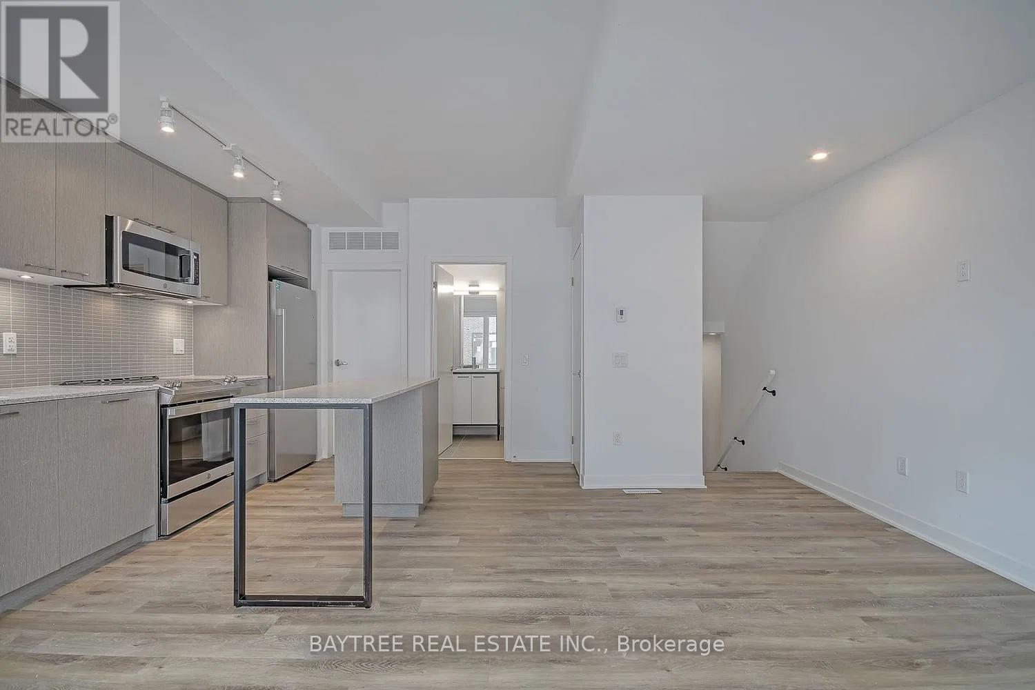 Th4 - 30 Ed Clark Gardens, Toronto, Ontario  M6N 0B5 - Photo 3 - W13144778