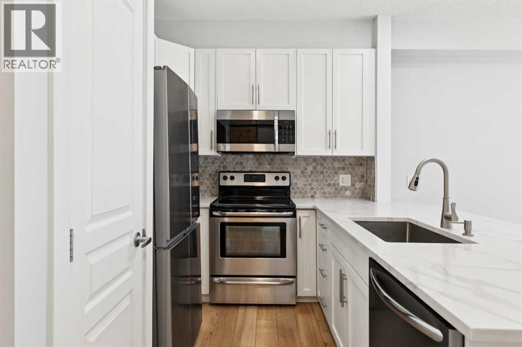 112, 10 Panatella Road NW, Calgary, Alberta  T3K 0V4 - Photo 4 - A2304815