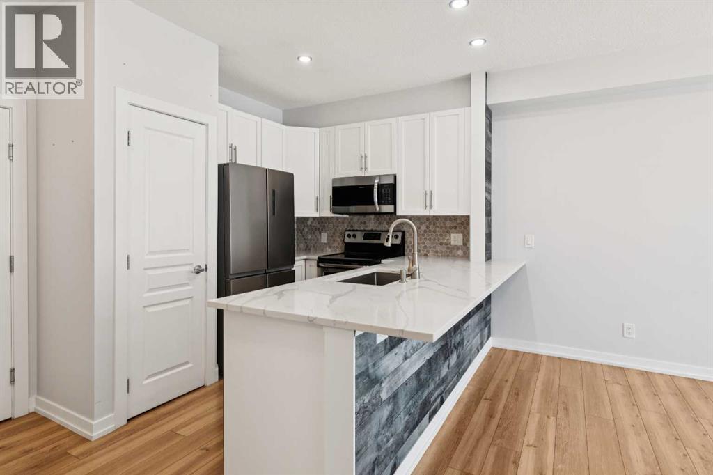 112, 10 Panatella Road NW, Calgary, Alberta  T3K 0V4 - Photo 5 - A2304815