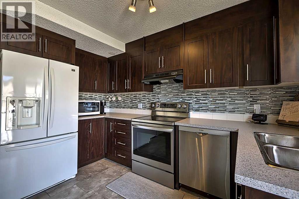 72 Deerpoint Road Se, Calgary, Alberta  T2J 6M9 - Photo 2 - A2311045