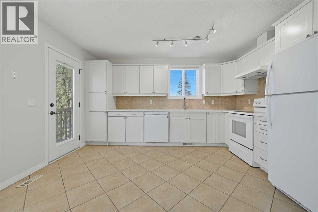 4 Woodstock Road SW, Calgary, Alberta  T2W 5V8 - Photo 9 - A2312247