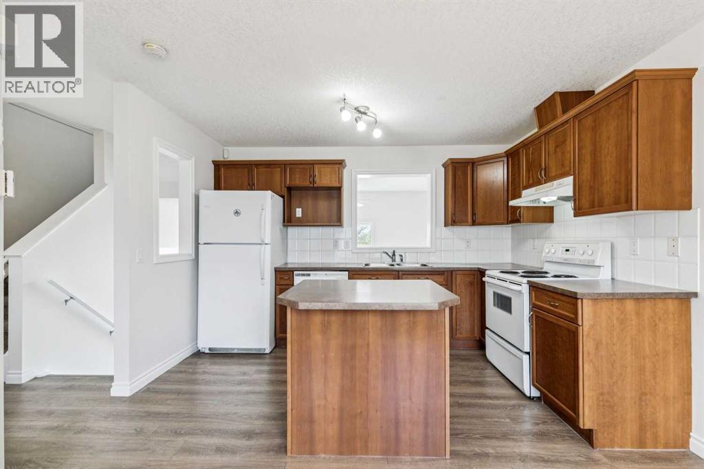 86 Crystal Shores Cove, Okotoks, Alberta  T1S 2B4 - Photo 16 - A2312641