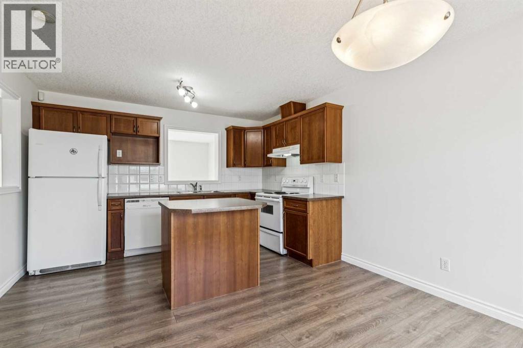 86 Crystal Shores Cove, Okotoks, Alberta  T1S 2B4 - Photo 18 - A2312641