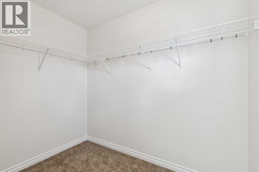86 Crystal Shores Cove, Okotoks, Alberta  T1S 2B4 - Photo 25 - A2312641