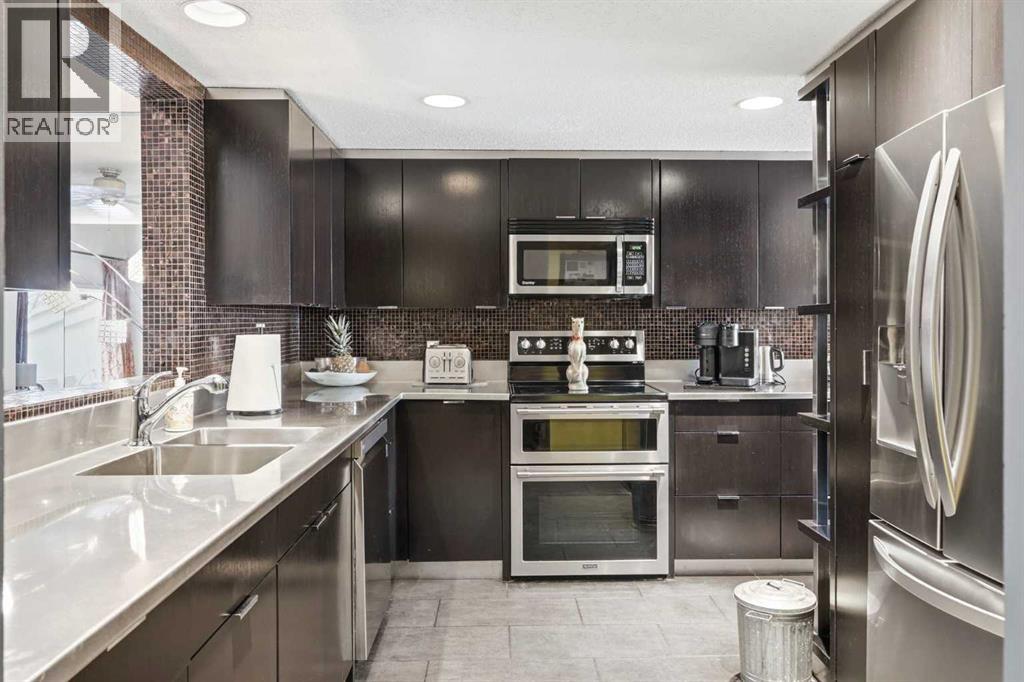 53, 5810 Patina Drive SW, Calgary, Alberta  T3H 2Y6 - Photo 3 - A2304159