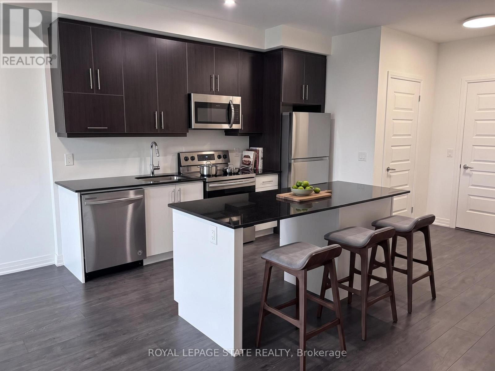 417 - 128 Grovewood Common, Oakville, Ontario  L9H 0X3 - Photo 4 - W13049220