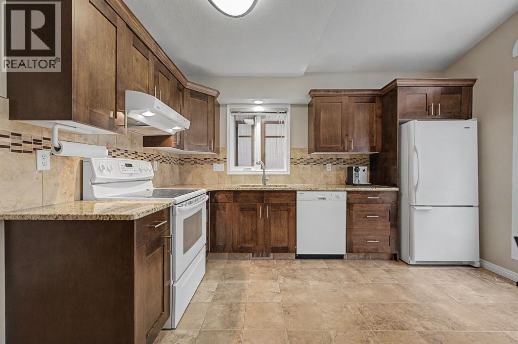 1206 19 Avenue NW, Calgary, Alberta  T2M 1A2 - Photo 5 - A2312731