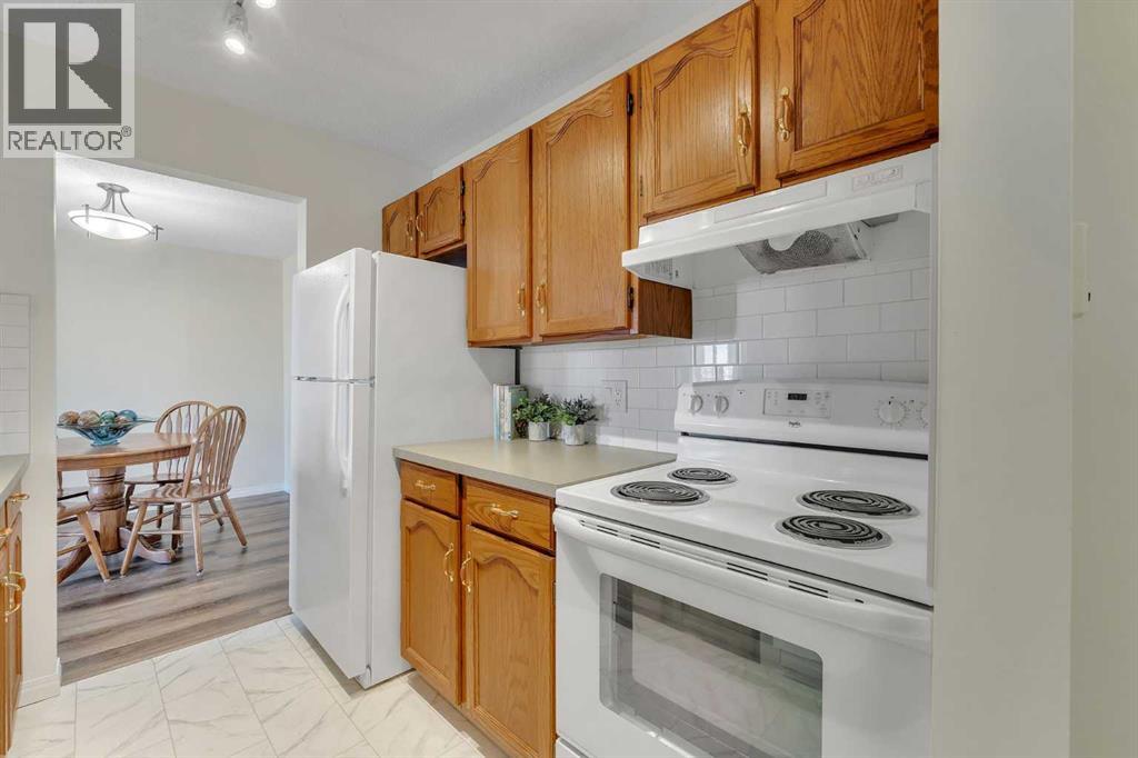 210, 309 Woodside Drive NW, Airdrie, Alberta  T4B 2E7 - Photo 3 - A2311433