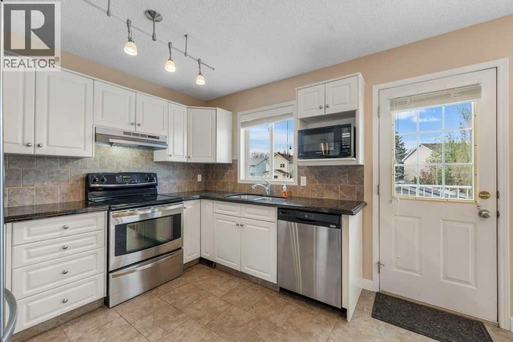 10744 Hidden Valley Drive NW, Calgary, Alberta  T3A 5K1 - Photo 6 - A2313517