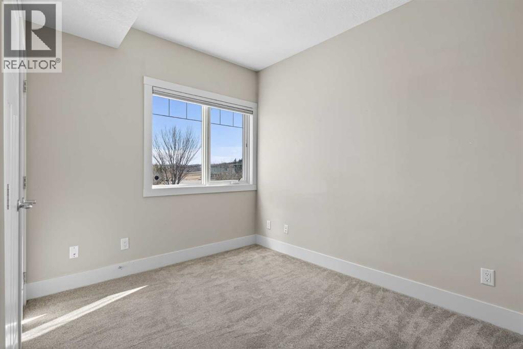 203, 77 George Fox Trail, Cochrane, Alberta  T4C 0N1 - Photo 35 - A2295000