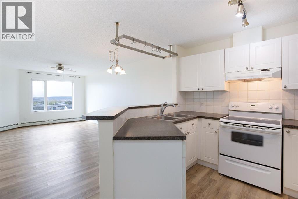 1205, 950 Arbour Lake Road NW, Calgary, Alberta  T3G 5B3 - Photo 4 - A2310465