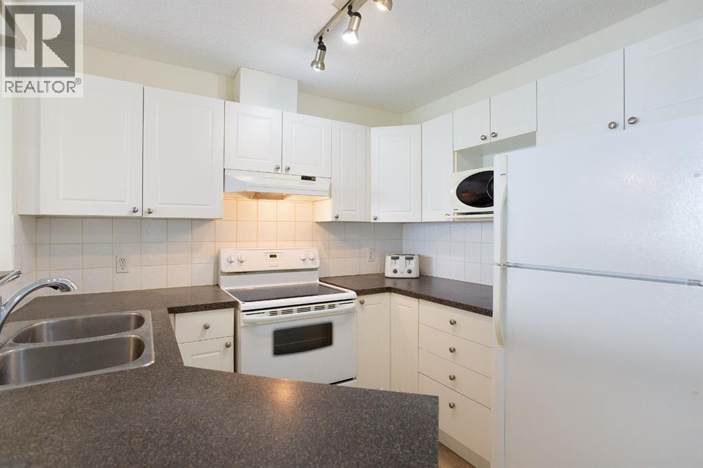 1205, 950 Arbour Lake Road NW, Calgary, Alberta  T3G 5B3 - Photo 6 - A2310465