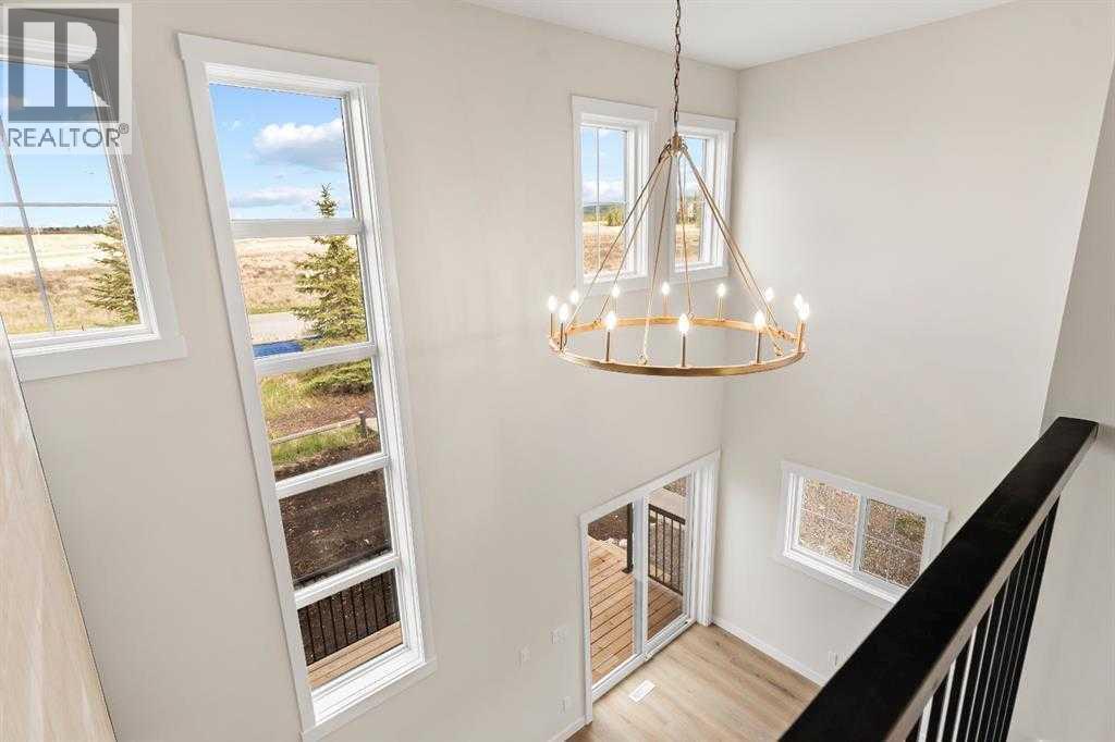 32 Cottageclub Lane, Rural Rocky View County, Alberta  T4C 1B1 - Photo 21 - A2311140