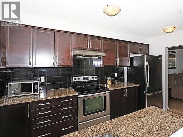 1341 Windstone Road SW, Airdrie, Alberta  T4B 0N7 - Photo 4 - A2313912