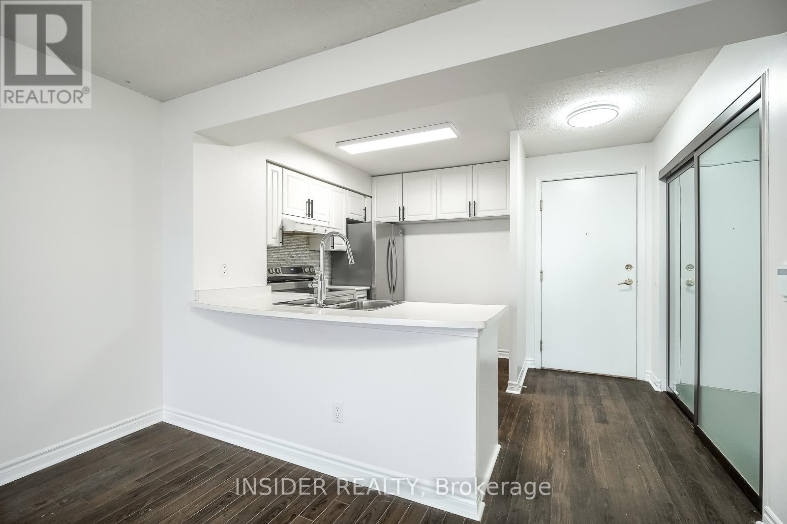 2009 - 35 Kingsbridge Garden Circle, Mississauga, Ontario L5R 3Z5 - Photo 2 - W13165358