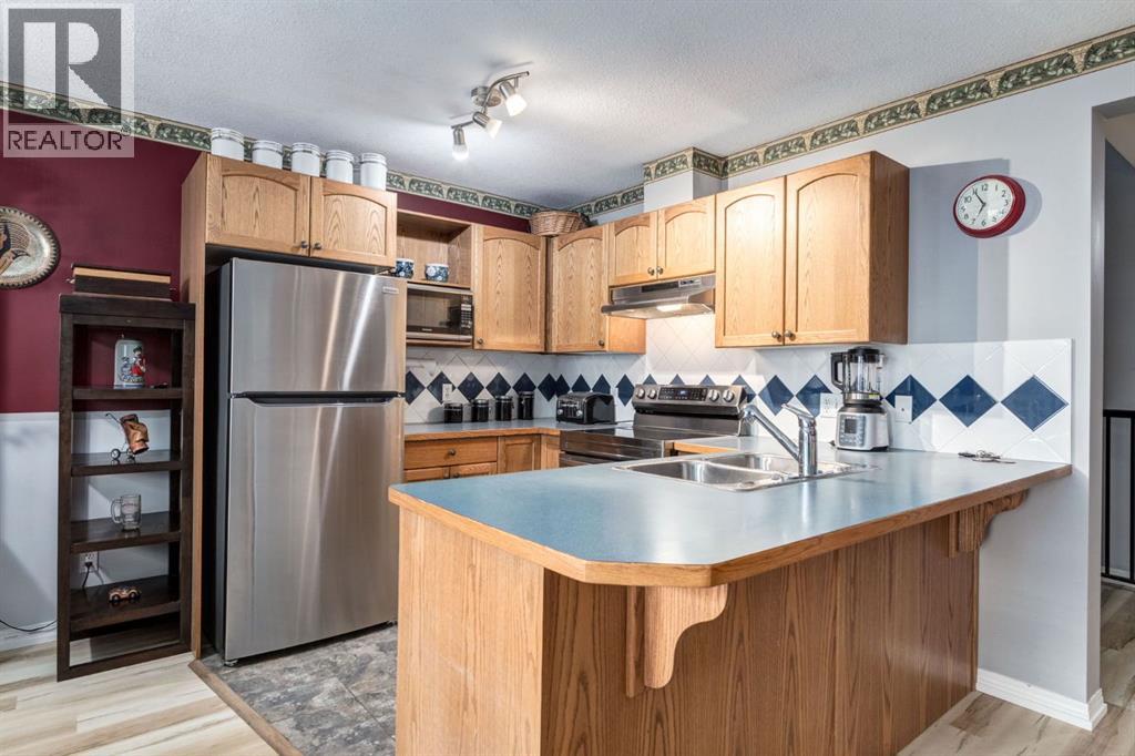 102 Cimarron Trail, Okotoks, Alberta  T1S 2G9 - Photo 8 - A2314001
