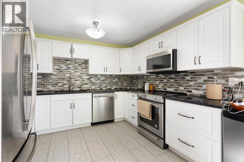8 Hawkfield Crescent Nw, Calgary, Alberta  T3G 1Z5 - Photo 7 - A2304656
