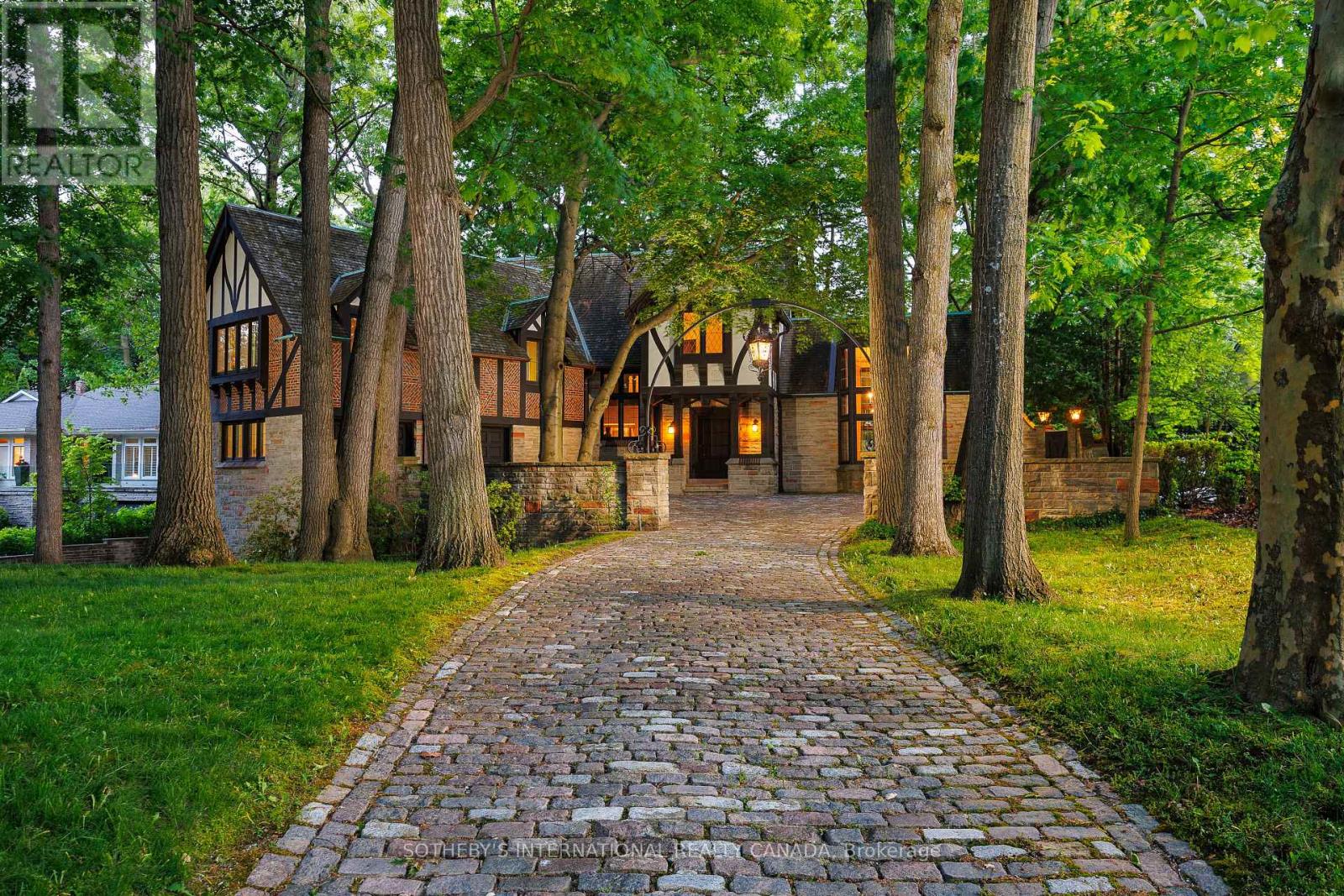 Step into elegance and history with this majestic Tudor estate, a unique gem backing onto St. George's Golf & Country Club, this rare find offers unparalleled charm and potential. This generational home is a testament to its enduring style and craftsmanship. Its timeless appeal and meticulous maintenance ensure it stands ready for your personal touch. From the original checkerboard tile floors to beamed ceilings and four masonry fireplaces, this home radiates timeless appeal. For those looking to make this exquisite home their own, the potential for modern customization is boundless. Imagine adding a new upper-floor bathroom, dual floating wine rack walls, or modern finishes that blend seamlessly with the home's original character. This charming estate, owned by a single family since its construction, features formal principal rooms, four masonry fireplaces, structural beamed ceilings, and dual cobblestone driveways. With parking for eight cars in the garage, multiple stone terraces, a cedar roof, and a stone-walled cobblestone courtyard, this property is designed to impress. Meticulously maintained, the estate boasts commercial-grade construction and offers level tableland at the rear, perfect for enjoying as-is or expanding as desired. Architecturally significant, this home was designed and built specifically for its unique site, commanding attention with its bespoke design and presence. This estate is more than a home; it's a legacy. Located in the prestigious Edenbridge-Humber Valley, it offers a unique lifestyle opportunity. The neighborhood is celebrated for its beautiful homes, lush greenery, and an atmosphere of close-knit community. It combines serene, upscale living with effortless access to the vibrant energy of Toronto. Enriched by excellent schools, charming shops, and convenient highways offering a harmonious blend of tranquility and urban sophistication. (id:48254)