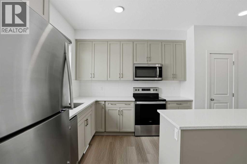 49 Belmont Drive SW, Calgary, Alberta T2X 4Z6 - Photo 4 - A2292315