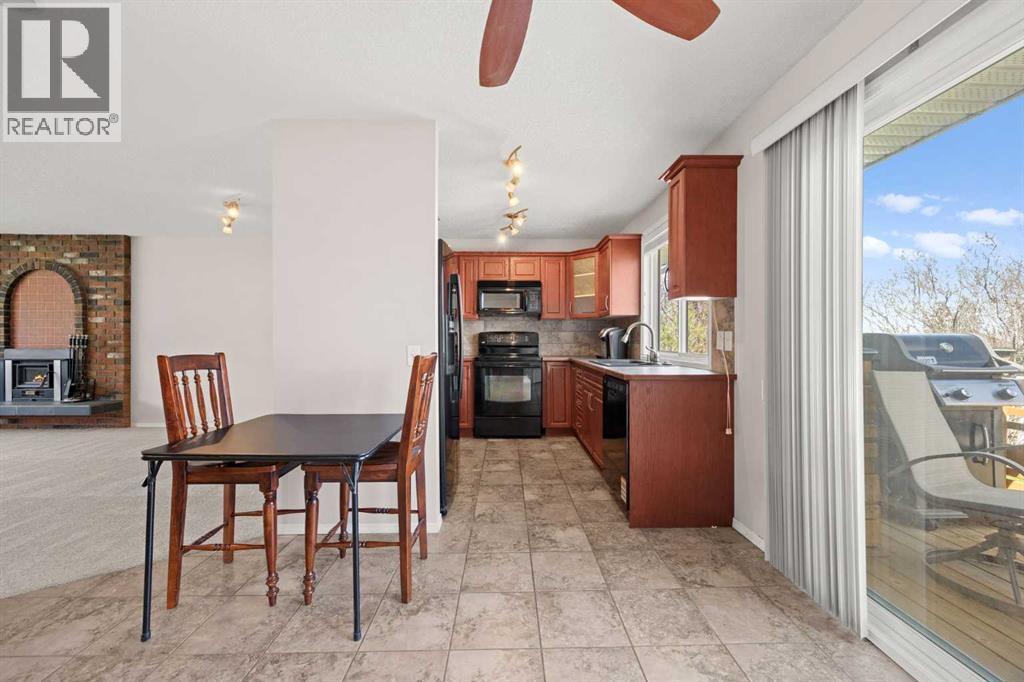 7720 Hunterquay Road NW, Calgary, Alberta  T2K 4T8 - Photo 17 - A2308100