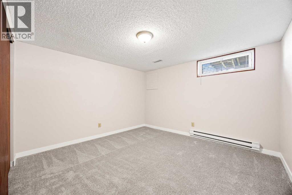 7720 Hunterquay Road NW, Calgary, Alberta  T2K 4T8 - Photo 35 - A2308100