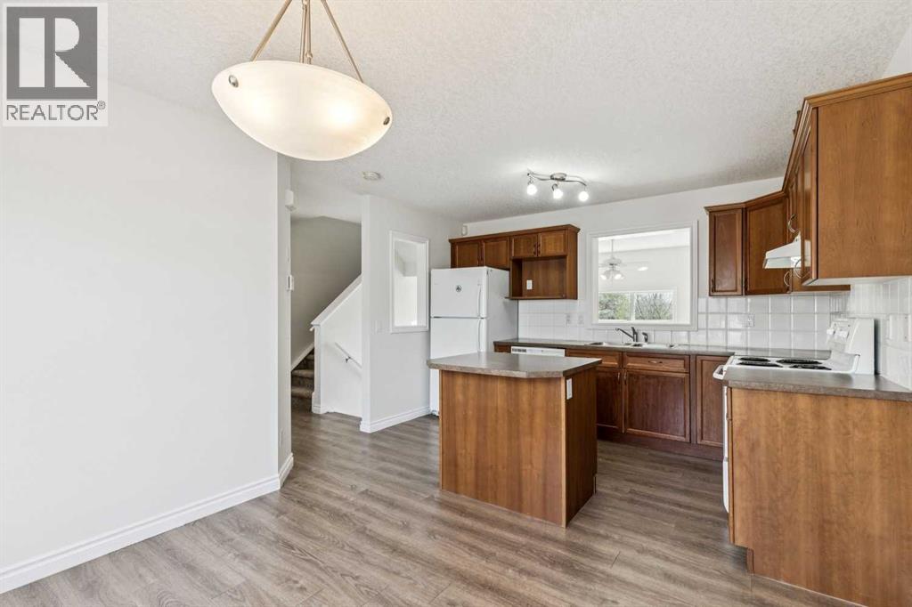 86 Crystal Shores Cove, Okotoks, Alberta  T1S 2B4 - Photo 19 - A2312641
