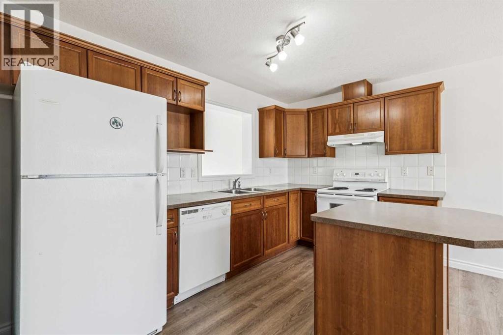 86 Crystal Shores Cove, Okotoks, Alberta  T1S 2B4 - Photo 15 - A2312641