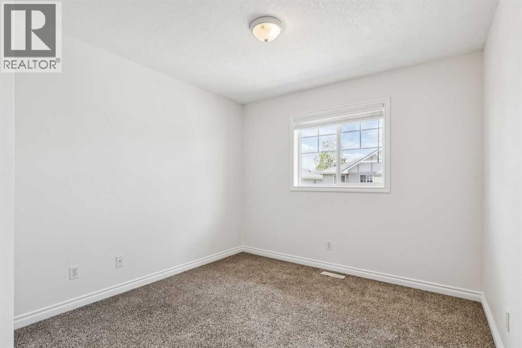 86 Crystal Shores Cove, Okotoks, Alberta  T1S 2B4 - Photo 30 - A2312641