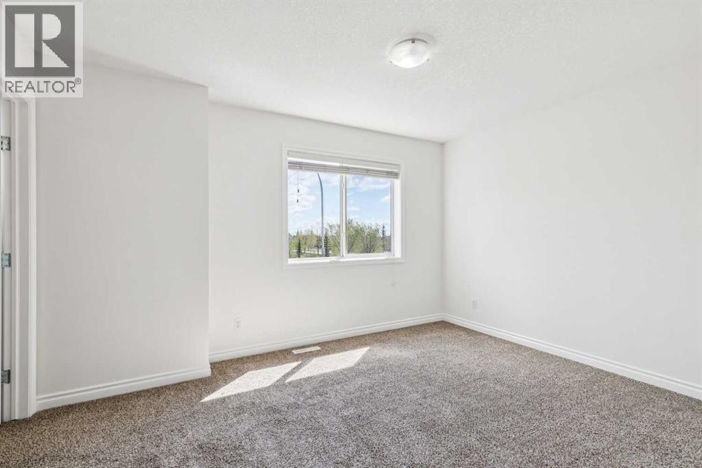 86 Crystal Shores Cove, Okotoks, Alberta  T1S 2B4 - Photo 22 - A2312641