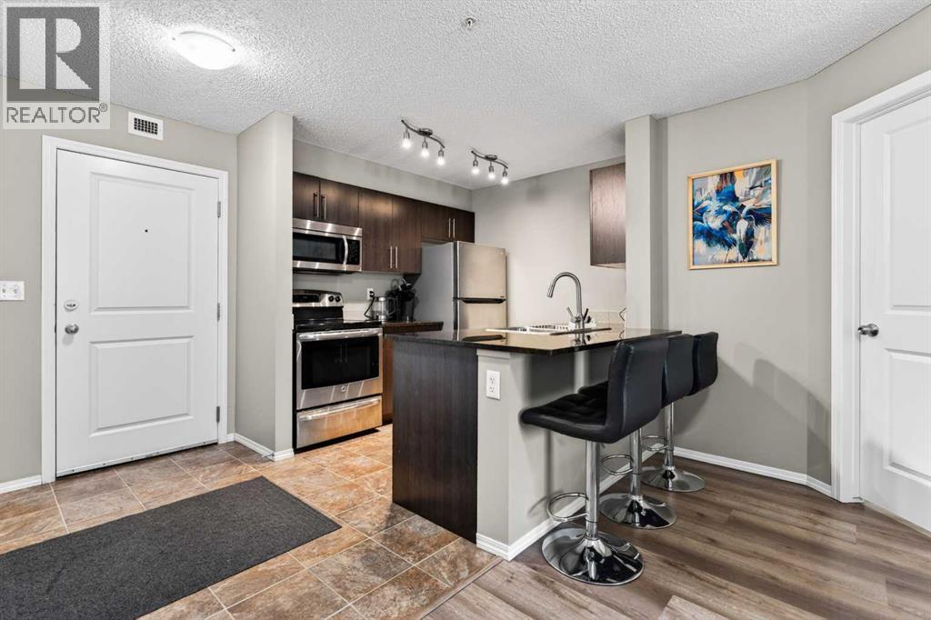 9103, 403 Mackenzie Way Sw, Airdrie, Alberta  T4B 3V7 - Photo 1 - A2313436