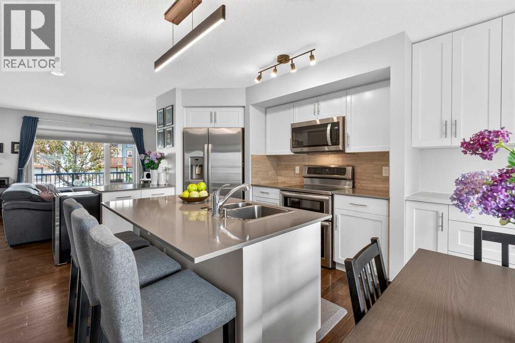 102 Panatella Hill NW, Calgary, Alberta  T3K 0B6 - Photo 5 - A2315190