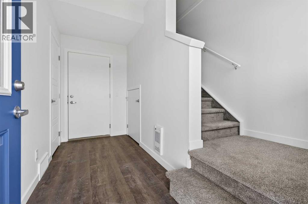 56 Creekside Drive Sw, Calgary, Alberta  T2X 6E2 - Photo 6 - A2311243