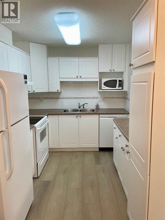 1207, 928 Arbour Lake Road Nw, Calgary, Alberta  T3G 5T2 - Photo 1 - A2277589