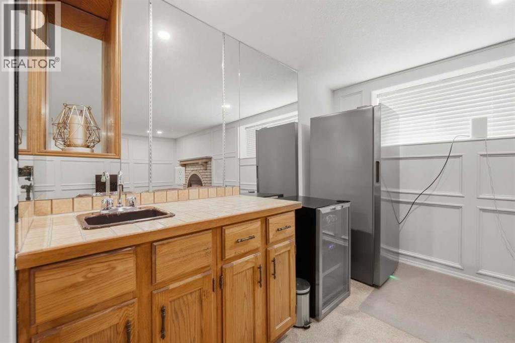 84 Coach Gate Way SW, Calgary, Alberta T3H 1Z7 - Photo 31 - A2316162