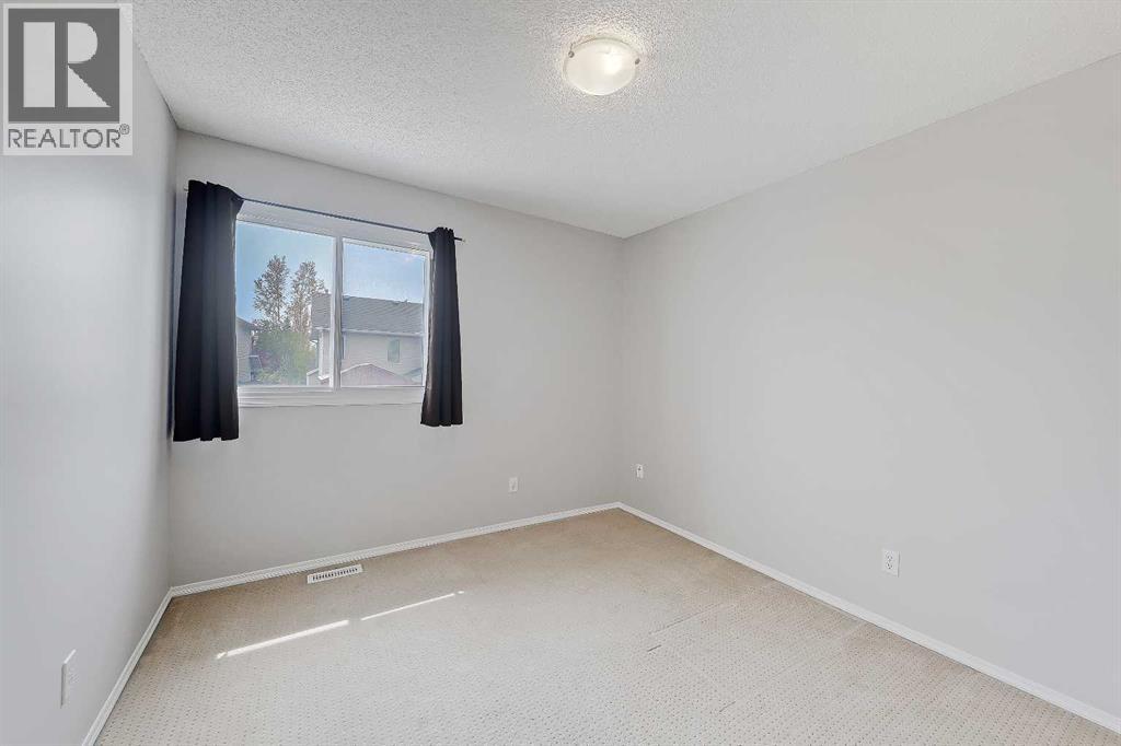 36 Mt Selkirk Close Se, Calgary, Alberta  T2Z 2R6 - Photo 28 - A2316027