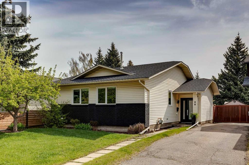 68 Woodmont Rise Sw, Calgary, Alberta  T2W 4L5 - Photo 1 - A2309817
