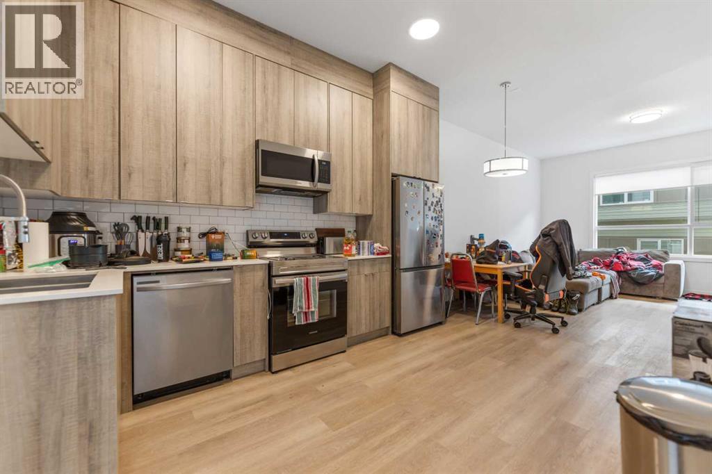 211, 101 Panatella Square Nw, Calgary, Alberta  T3K 2R9 - Photo 2 - A2313128